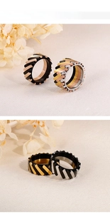 Mechanical gear-textured stainless steel rings in black, gold, silver and rose gold finishes