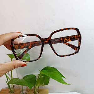 Detailed view of tortoiseshell square glasses frame showing size specs on the temple
