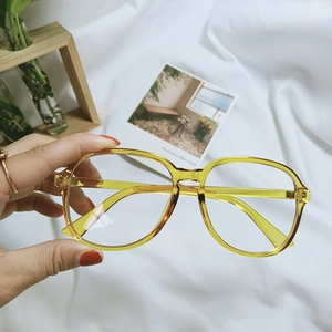 Detail view of transparent yellow oversized frame glasses with dimensions 51-18-137