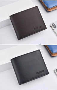 Macro view of men's tri-fold wallets in black and dark brown with litchi grain texture