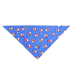Detailed flat lay of blue cotton Christmas pet bandana with festive Santa sport patterns