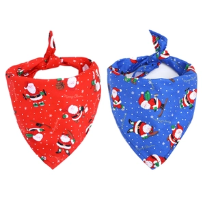 Christmas pet bandanas in red and blue featuring Santa Claus prints and Merry Christmas text