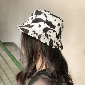 Reversible panda bucket hat featuring cute cartoon prints for women with a black and white design
