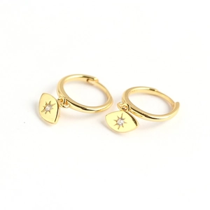 Gold s925 silver huggie earrings with diamond-set starburst eye-shaped pendant