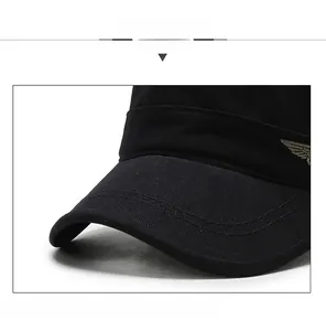 Detail of black cotton flat top army cap showing reinforced brim and wing embroidery