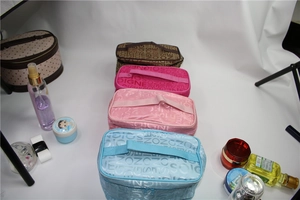 Detailed group view of colorful SOIGNE letter print cosmetic bags with top handles