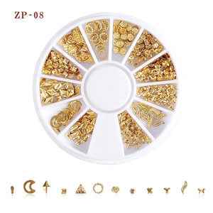 Detailed gold nail art studs set with moon and star shapes in a 12-slot rotary case