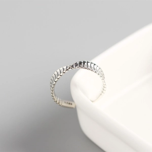 Close-up of S925 sterling silver Möbius ring with textured pattern and silver hallmark