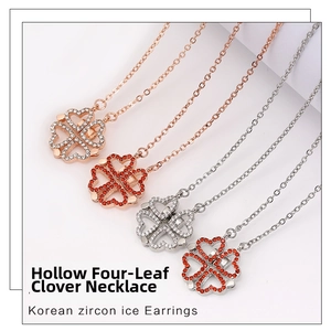 Detail of four-leaf clover necklaces with pavé zircon heart shapes in rose gold and silver