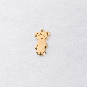 Macro detail of 20mm polished gold steel girl pendant charm with smooth mirror surface