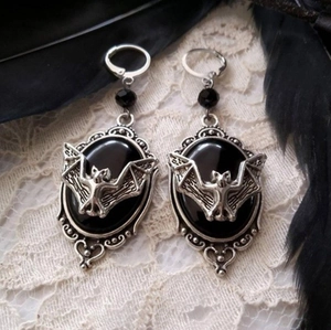 Gothic silver earrings with black oval stones and bat motif on lace and feathers