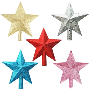 Detailed view of colorful glitter star tree toppers in gold, silver, red, blue, and pink