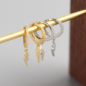 Detail of S925 sterling silver lightning bolt hoop earrings with cubic zirconia stones