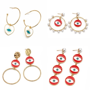 Detailed grid showing four gold-plated evil eye earrings with enamel finish and pearls
