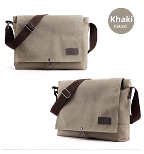 Detailed macro view of khaki canvas messenger bag showing the brand logo and metal buckle
