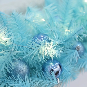 Light blue artificial Christmas garland with navy ornaments and warm white LED lights