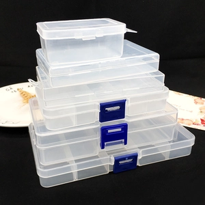 Stack of clear mini plastic storage boxes with blue latches and interior dividers