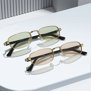 Retro rectangle metal sunglasses with gold frames and tinted lenses on white podium