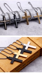 Detail of double-layer stainless steel cross necklaces in black, gold, and silver finishes