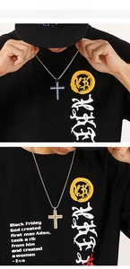 Detail shot of double-layered cross pendant with sparkling rhinestones for men