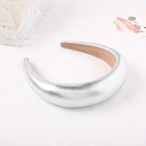 Macro detail of padded silver metallic headband with anti-slip soft velvet lining