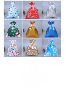 Detail of Christmas drawstring gift bags in metallic colors with festive patterns