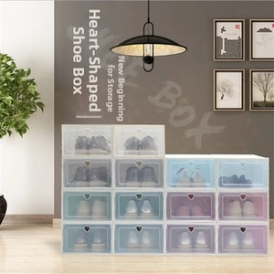 Close-up of stackable storage boxes with heart-shaped handles in multiple pastel colors