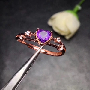 Rose gold plated ring featuring a heart-shaped purple amethyst and white side diamonds