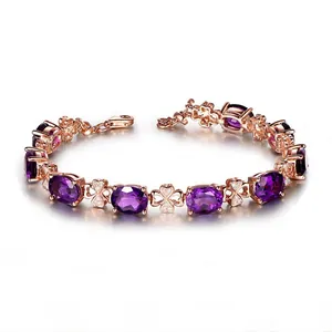 Detail view of rose gold clover bracelet with oval purple amethysts and lobster clasp