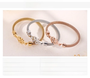 Detail showing woven stainless steel bangles in gold, rose gold, and silver finishes