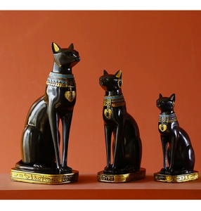 Three-piece black and gold Egyptian Bastet cat statues in various sizes for decor