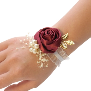 Burgundy satin rose bridal wrist corsage with gold leaves and white pearl accents