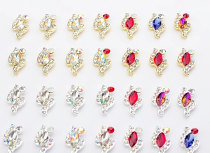Macro shot of S-shaped alloy nail art rhinestones in various colors for DIY manicure