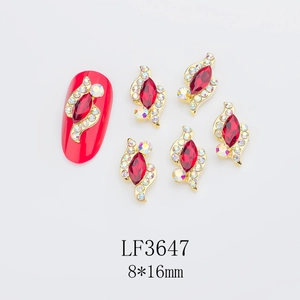 Detail showing 8x16mm red marquise crystal nail jewelry with golden alloy base and AB rhinestones