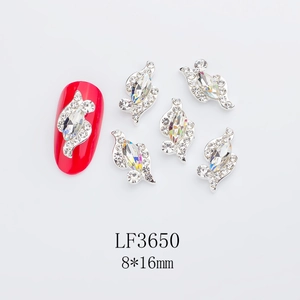 Close-up of LF3650 marquise crystal nail art charms with silver alloy base on red nails