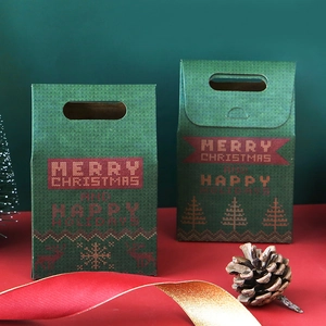 Green Christmas gift box with reindeer knitting pattern and Merry Christmas text
