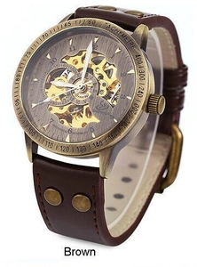 Detail of retro bronze mechanical watch featuring hollow dial and brown leather rivet strap