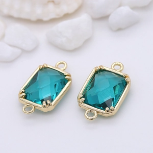 Detail of teal faceted glass charms with 14k gold plated borders and double hanging loops