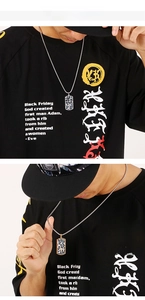 Close-up of men's punk cross dog tag necklace with leopard print on a silver chain