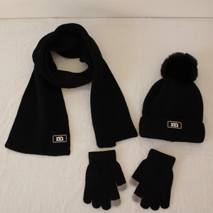 Black knitted kids winter set including hat with pompom, scarf and touchscreen gloves