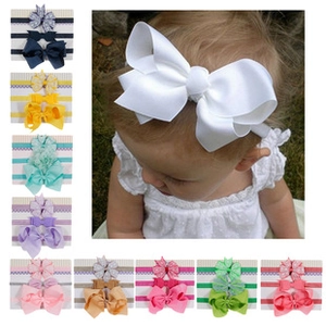 Detail view of multi-color baby headbands set featuring large decorative bow knots