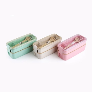 Three-piece 750ml wheat straw lunch box set with utensils in green, beige, and pink