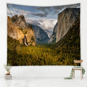 Detailed close-up of a scenic waterfall landscape tapestry in a cozy living room setting