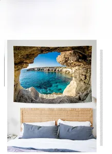 Detail view of Bohemian seaside cave landscape tapestry on a bedroom wall decoration