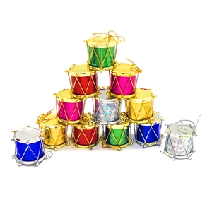 Colorful Christmas drum ornaments set in vibrant metallic finishes for festive tree decor