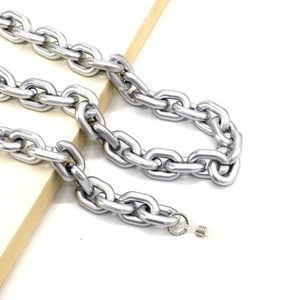 Detail of matte silver acrylic eyeglass chain with metal rings and silicone loops