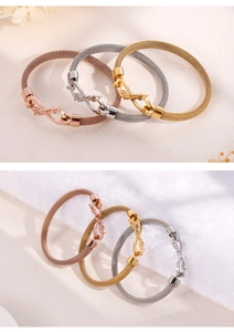 Detailed view of woven mesh bracelets in rose gold, silver and gold with Forever charm