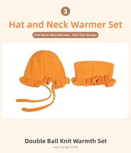 Close-up of orange knitted baby hat and scarf set with ruffle detail and secure chin straps