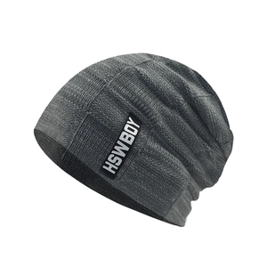 Detailed view of dark grey beanie with checkerboard knit texture and HSWBOY label