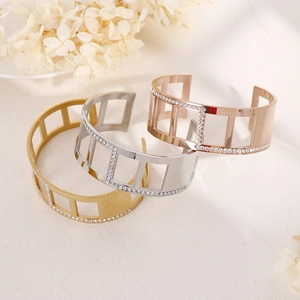 Three striped titanium steel cuff bracelets in gold, silver, and rose gold with rhinestones